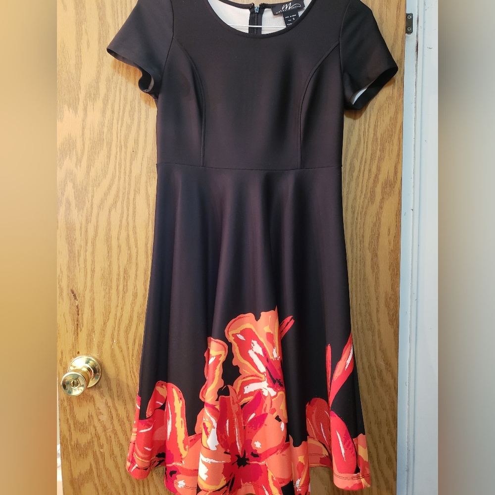 Very pretty black dress with orange/red floral pattern on the bottom.